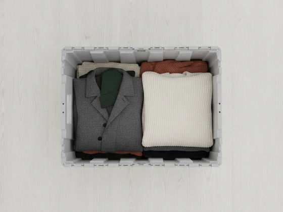 A crate packed with winter coats